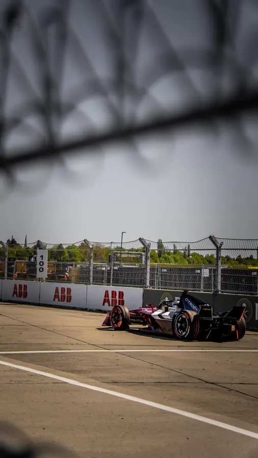Formula E car framed by a fence, Berlin E-Prix