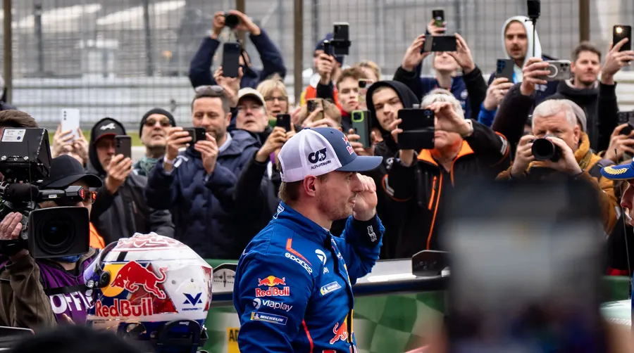 Max Verstappen surrounded by press photographers in the NLS pit lane