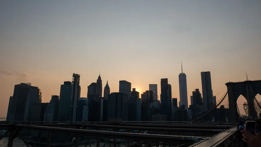 Manhattan skyline silhouette at sunset, New York