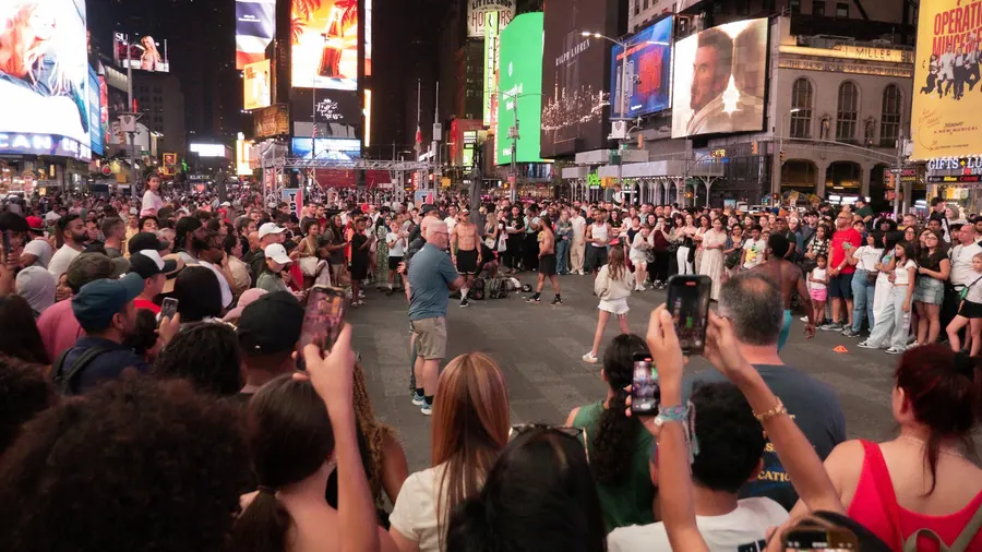 Crowd of people on Times Square at night, New York