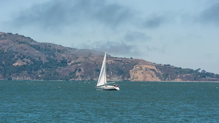 Sailboat in San Francisco Bay in front of the Marin Headlands